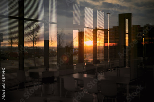 modern dining room in empty office building with sunset flare effect
