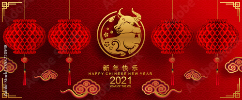 Chinese new year 2021 year of the ox , red paper cut ox character,flower and asian elements with craft style on background.(Chinese translation : Happy chinese new year 2021, year of ox)