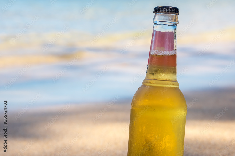Cool refreshing alcoholic drink in the sand & shade at a tropical beach next to the ocean. Concept for retirement, travel and stress free. Cool refreshing alcoholic drink in the sand & shade at a tropical beach next to the ocean. Concept for retirement, travel and stress free.