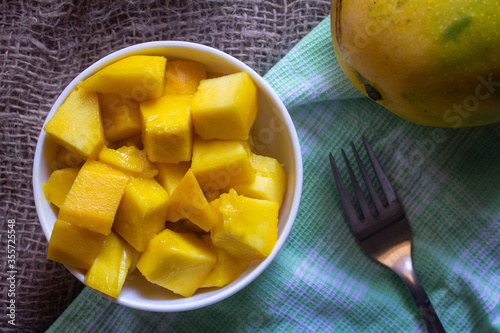 Imam Pasad mango(considered king of mangoes) cut into cube shape. Tasty Himam Pasand mangoes sliced. photo