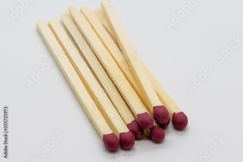 matches with red head, on a white background , studio photography
