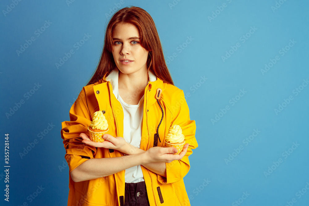 young girl with yellow cupcake young girl with yellow cupcake
