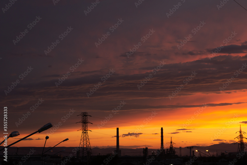 Beautiful sky at sunset with towering towers, lanterns, houses