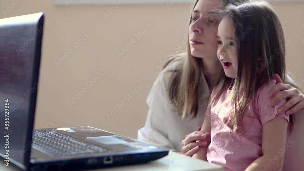 small child plays on computer. The child Prodigy learns the techniques of business Planning, home work, quarantine, self-isolation, protection from coronavirus, virus, home education, distance work. small child plays on computer. The child Prodigy learns the techniques of business Planning, home work, quarantine, self-isolation, protection from coronavirus, virus, home education, distance work.
