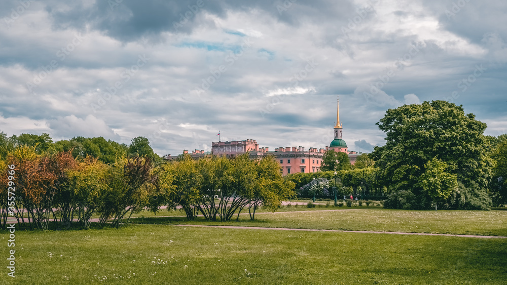 Panoramic view of the summer cityscape in St. Petersburg. Russia. Green lawn in field of Mars