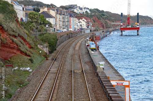 Repair works on the West Coast mainline station at Dawlish in Devon following the collapse of the tracks during the storms of February 2014. A repair platform can be seen in the sea