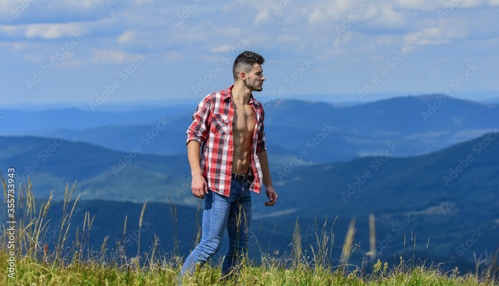 A decision for nature. travelling adventure. hipster fashion. countryside concept. farmer on rancho. man on mountain. camping and hiking. sexy macho man in checkered shirt. cowboy in hat outdoor