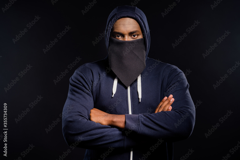 Portrait of serious afro american guy cross hands ready stop racism discrimination wear jumper sweater isolated over black color background Portrait of serious afro american guy cross hands ready stop racism discrimination wear jumper sweater isolated over black color background