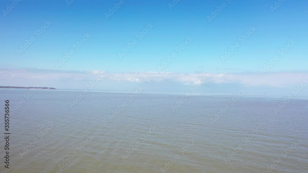An aerial view of an empty sandy beach. Pandemic quarantine. Whitstable, Kent, UK