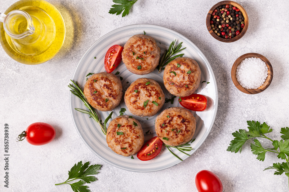Fresh chiken cutlets with tomatoes and rosemary