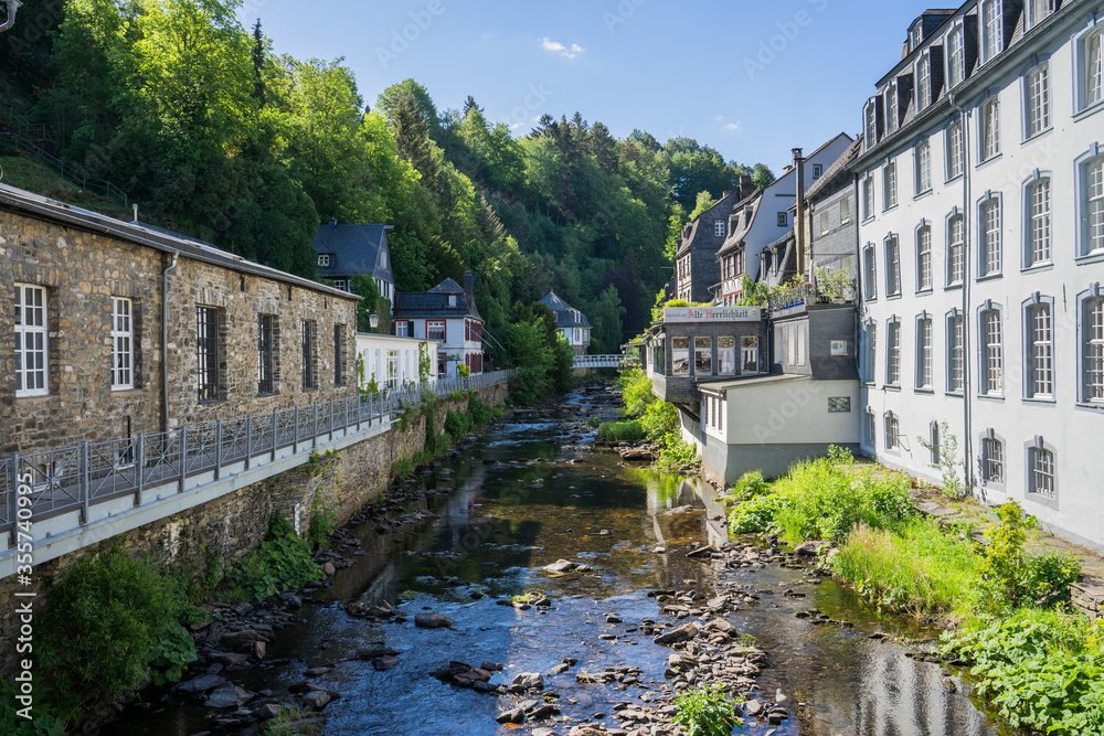 Monschau town in Germany street view with half-timbered houses and Rur river - a small resort town in the Eifel region of western Germany, located in the Aachen district of North Rhine-Westphalia 