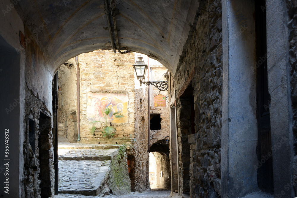 very narrow street in typical mediterranean village