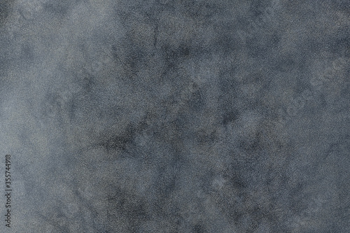 Stormy tie-dye grey leather texture background. closeup view of suede