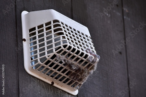 A dryer vent in need of cleaning to prevent a fire.
