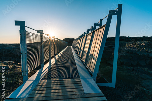 Bridge Between Continents is located in Reykjanes peninsula easily accessible from Reykjavik the capital town of Iceland. Tourism in Iceland. High quality photo during golden hour