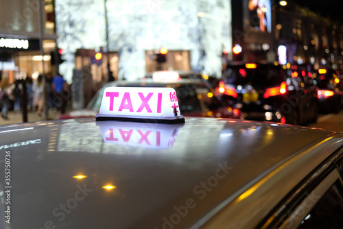 Night time taxi on HongKong streets blured background photo