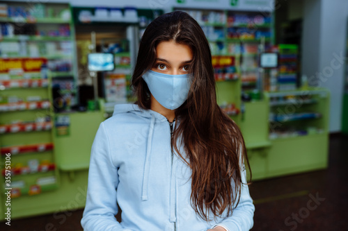 Portrait of beautiful young woman at pharmacy