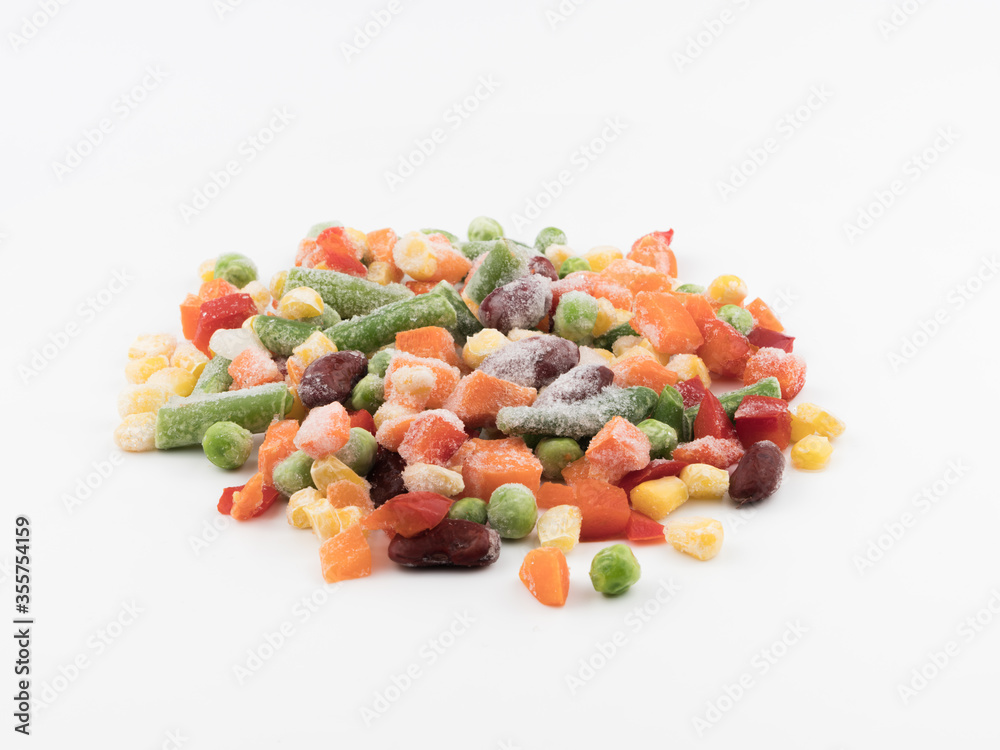 Frozen vegetables on a white background. Mexican blend. Frozen vegetables on a white background. Mexican blend.