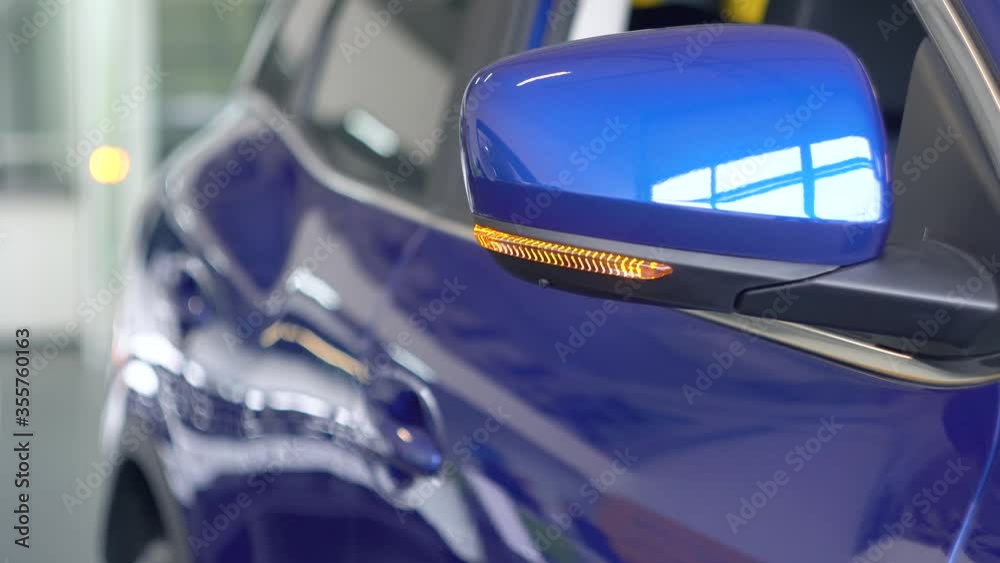 Details of switched on turning lights of anonymous prestigious luxury modern car. Concept of passion for driving cars and engines Details of switched on turning lights of anonymous prestigious luxury modern car. Concept of passion for driving cars and engines