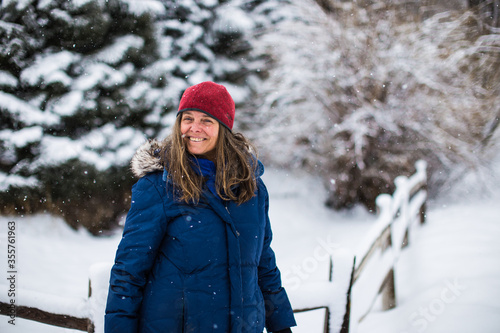 A beautiful middle aged woman in the snow on a cold day in Colorado, USA