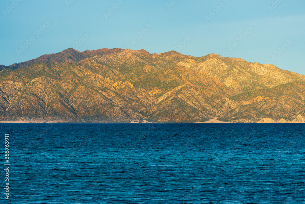 Landscape scenery with mountain hills and ocean waters from Baja California in Mexico