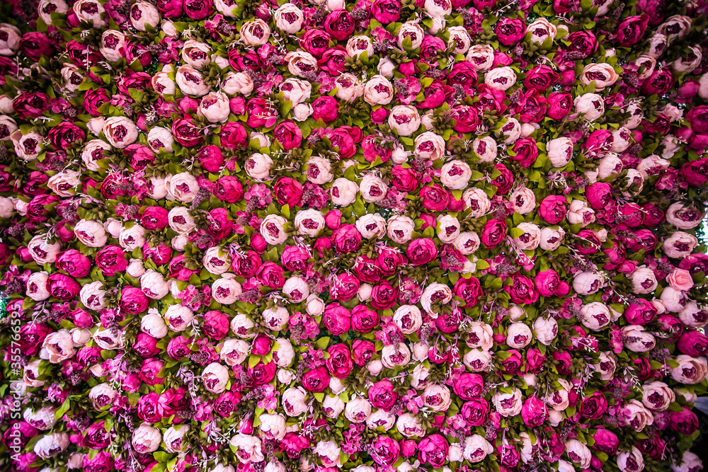 Wedding reception floral backdrop with pink peony flowers