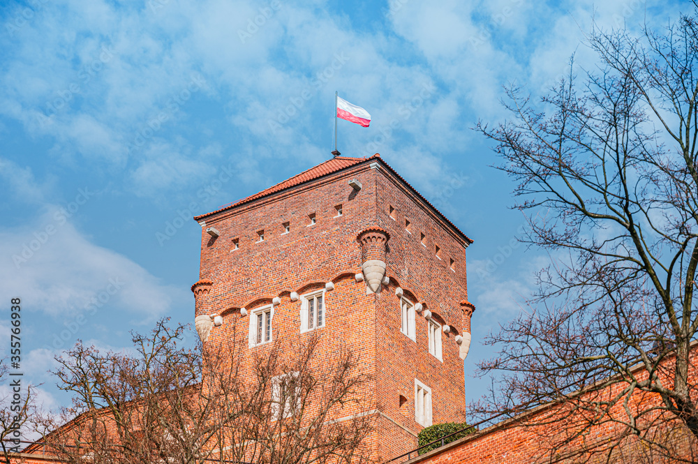 Polish flag on a tower of Wawel Royal Castle in Krakow, Poland