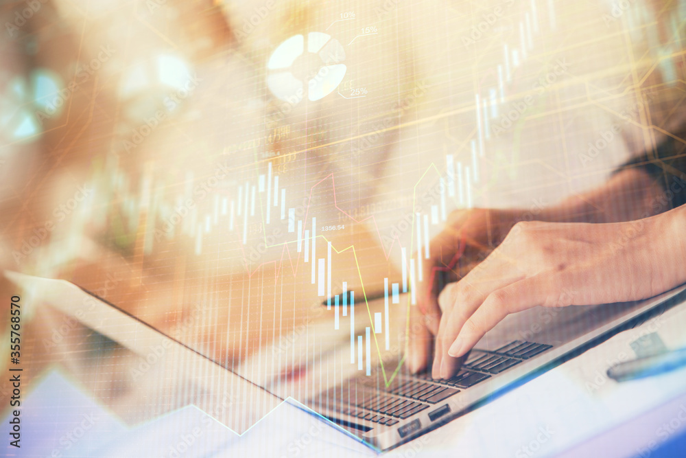 Double exposure of woman hands typing on computer and forex chart hologram drawing. Stock market invest concept. Double exposure of woman hands typing on computer and forex chart hologram drawing. Stock market invest concept.