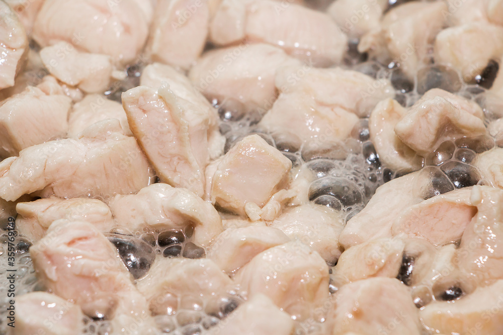 Slices of fried chicken in a pan. Cooking process. Slices of fried chicken in a pan. Cooking process.