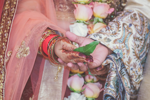 Indian Hindu wedding ceremony ritual items hands close up © Stella Kou