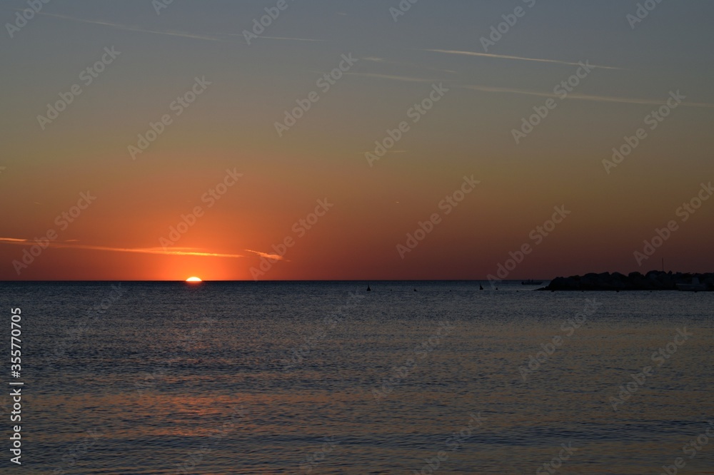 seascape at sunset time in the tourist resort of Vada in the municipality of Rosignano Marittimo on the Livorno coast in Tuscany, Italy