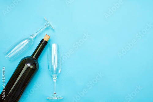 A bottle of wine and two glasses, an alcoholic drink. The concept of rest and relaxation, celebration and drinking