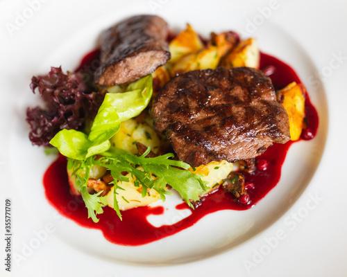 grilled duck steak with cowberry sauce and potato