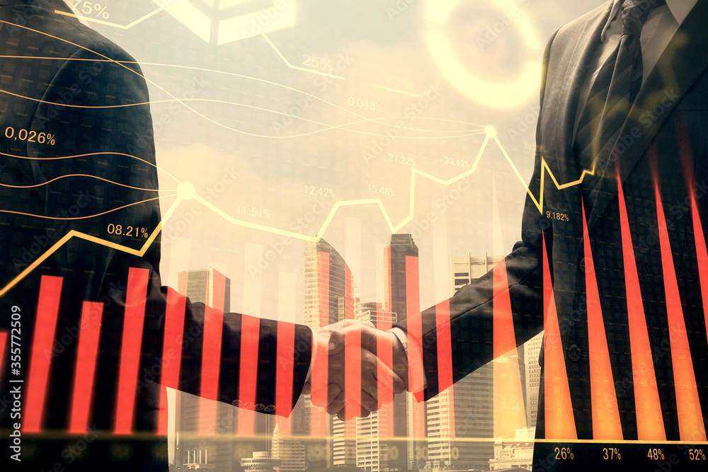 Double exposure of forex graph hologram and handshake of two men. Stock market concept. Double exposure of forex graph hologram and handshake of two men. Stock market concept.