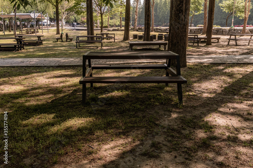 Fototapeta Naklejka Na Ścianę i Meble -  Picnic tables in a public park