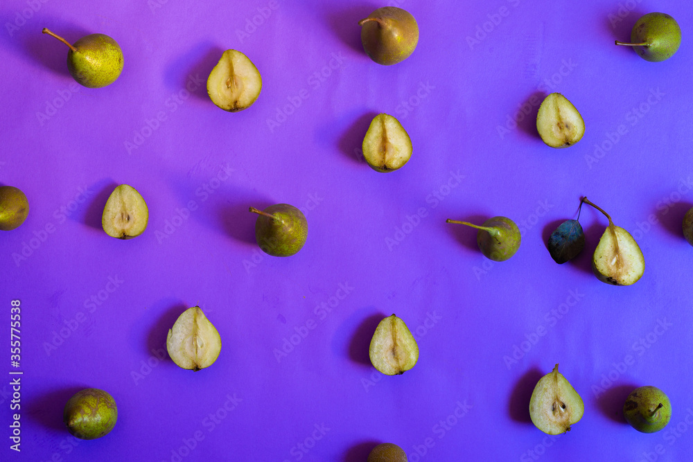 Pieces of pear on a blue background in the form of a pattern