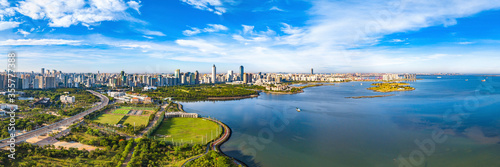 Haikou City Skyline in the Binhai Avenue Central Business District with Office Buildings and Evergreen Park View, Hainan Province, The Largest Pilot Free Trade Zone in China, Asia. Panorama View.