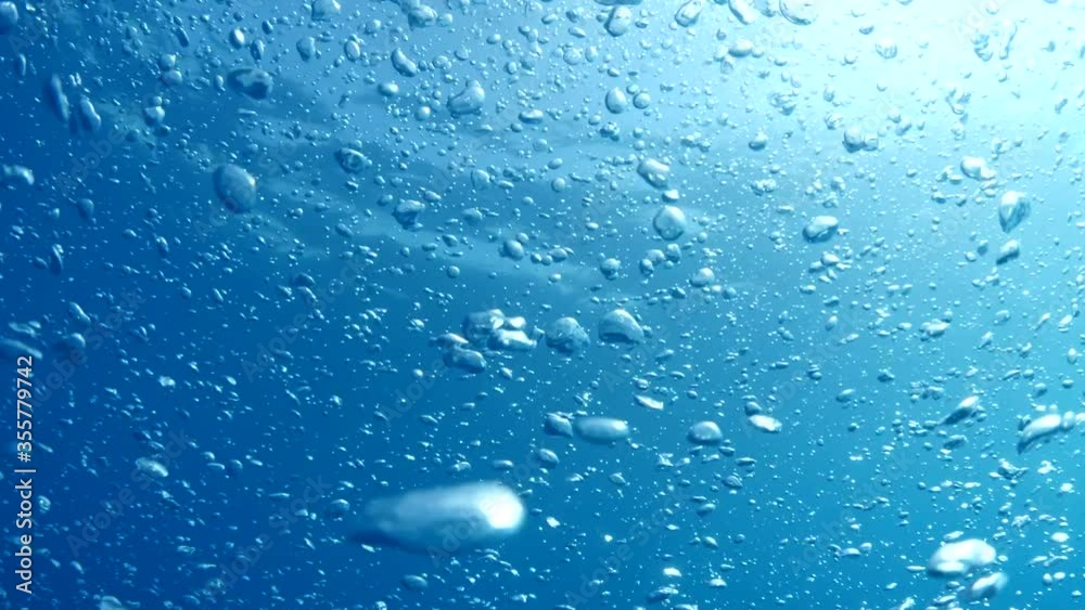 air bubbles slow underwater coming up scenery dark blue and sun shine ocean scenery air bubbles slow underwater coming up scenery dark blue and sun shine ocean scenery