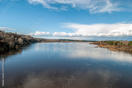 Spring flood of the river, flooded coastal bushes and trees.The river spread wide.