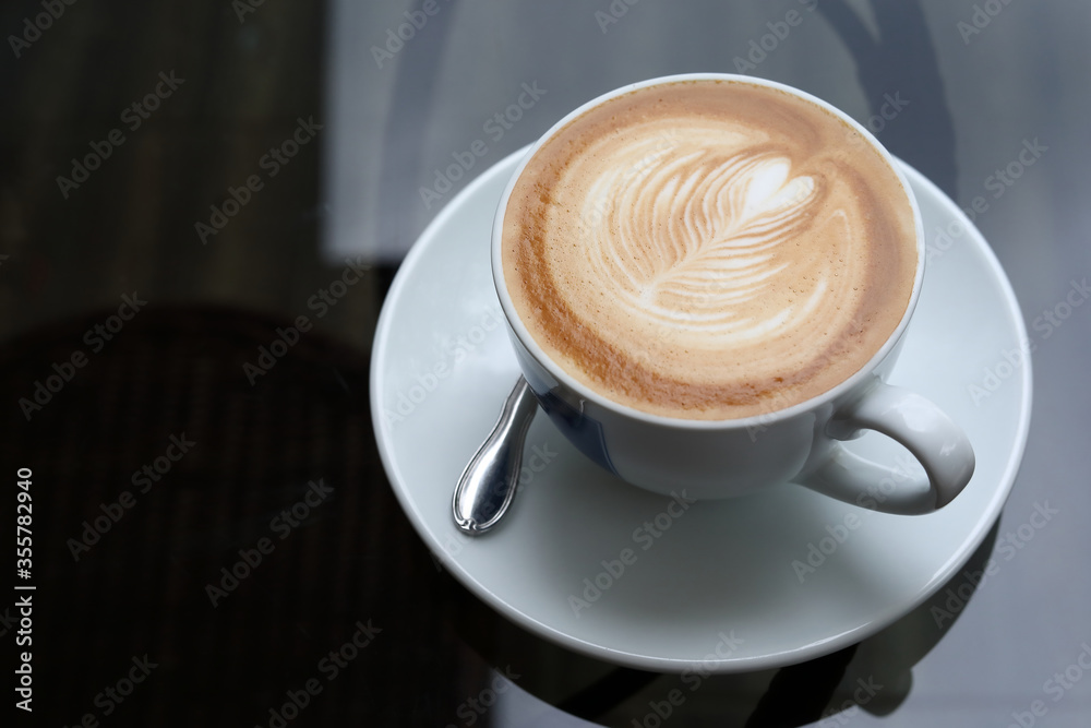 hot latte coffee drink put on table in cafe