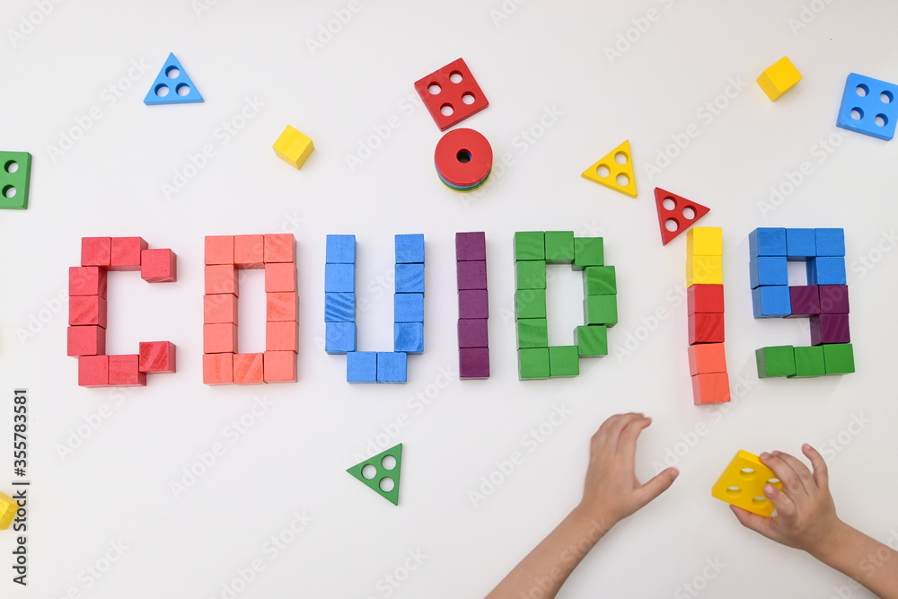 kid learning study topic COVID-19 coronavirus from wooden block toy kid learning study topic COVID-19 coronavirus from wooden block toy