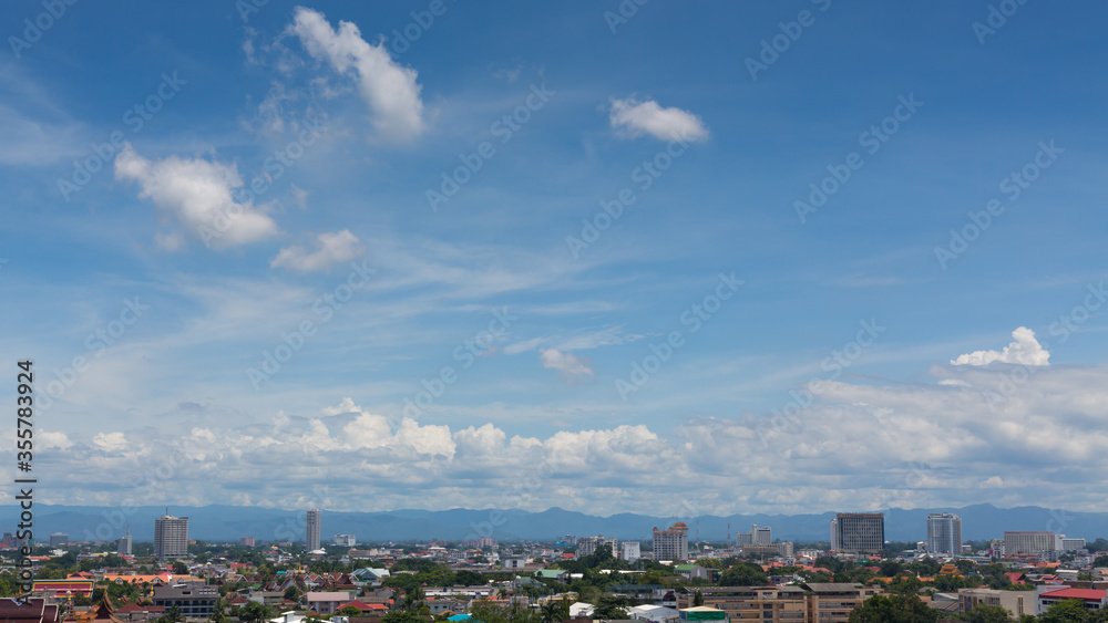 white cloud on blue sky above the town, aerial view cityscape