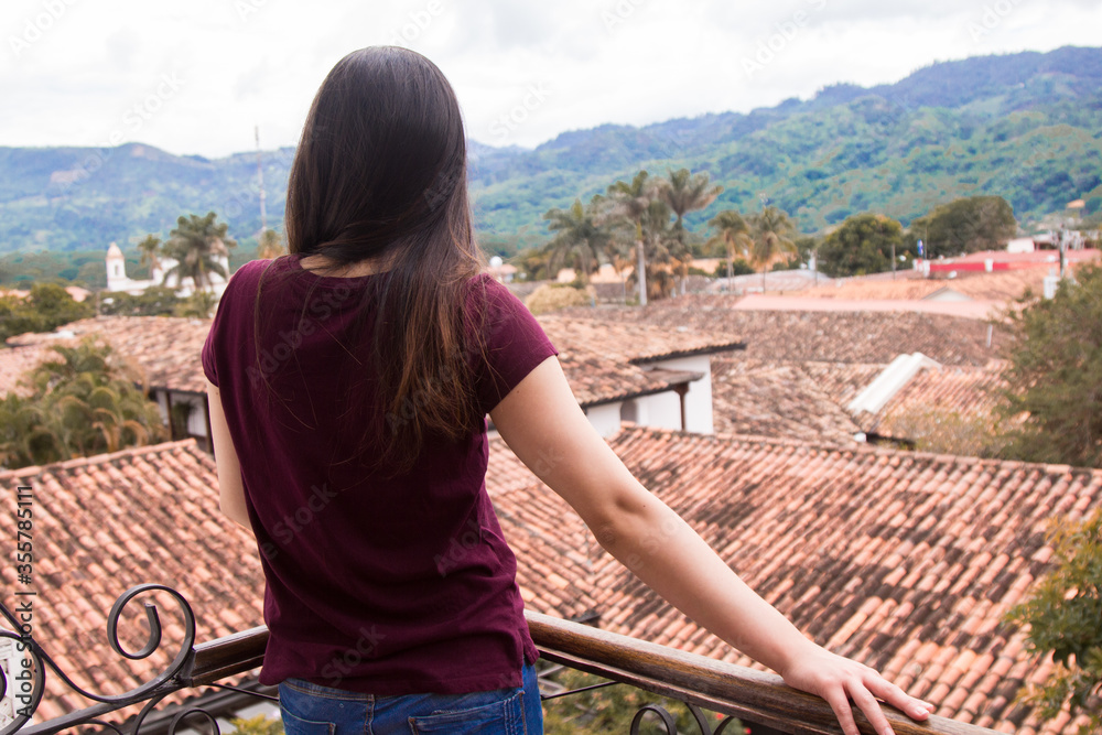 Fototapeta premium Unrecognizable Young Woman Watching The City