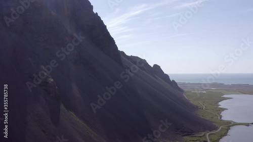 Aerial shot of scenic mountains by sea against sky - Southwestern Iceland, Iceland photo