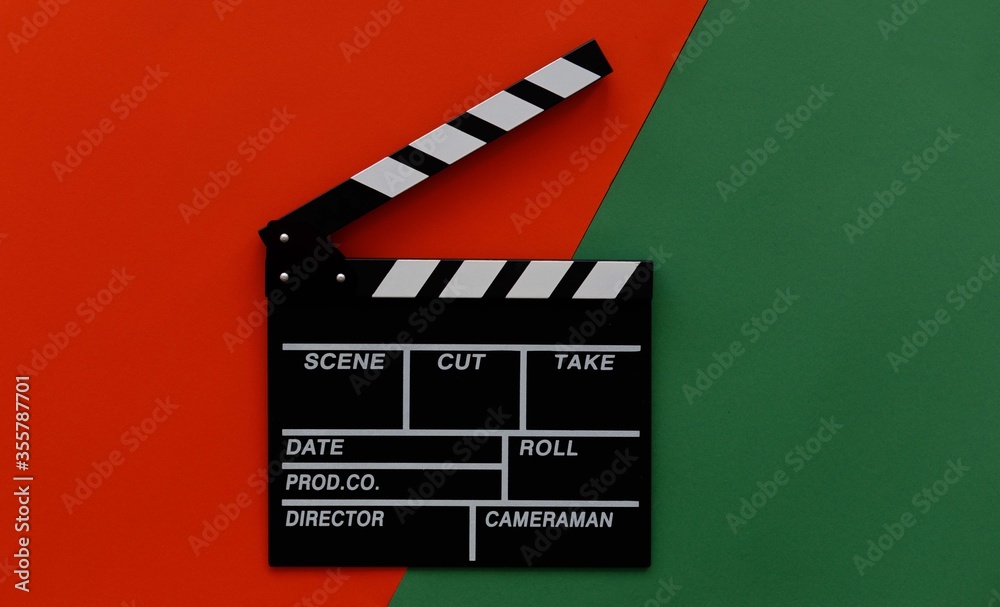 Filmmaking concept. Movie Clapperboard. Cinema begins with movie clappers. Movie clapper on a green and on a red background.