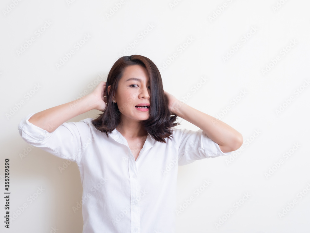 Portrait of young asian woman standing and smiling Portrait of young asian woman standing and smiling