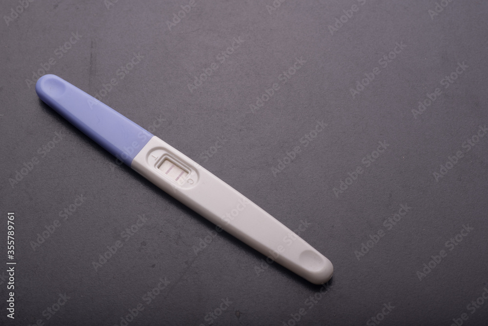 A pregnancy test kit isolated over various background A pregnancy test kit isolated over various background