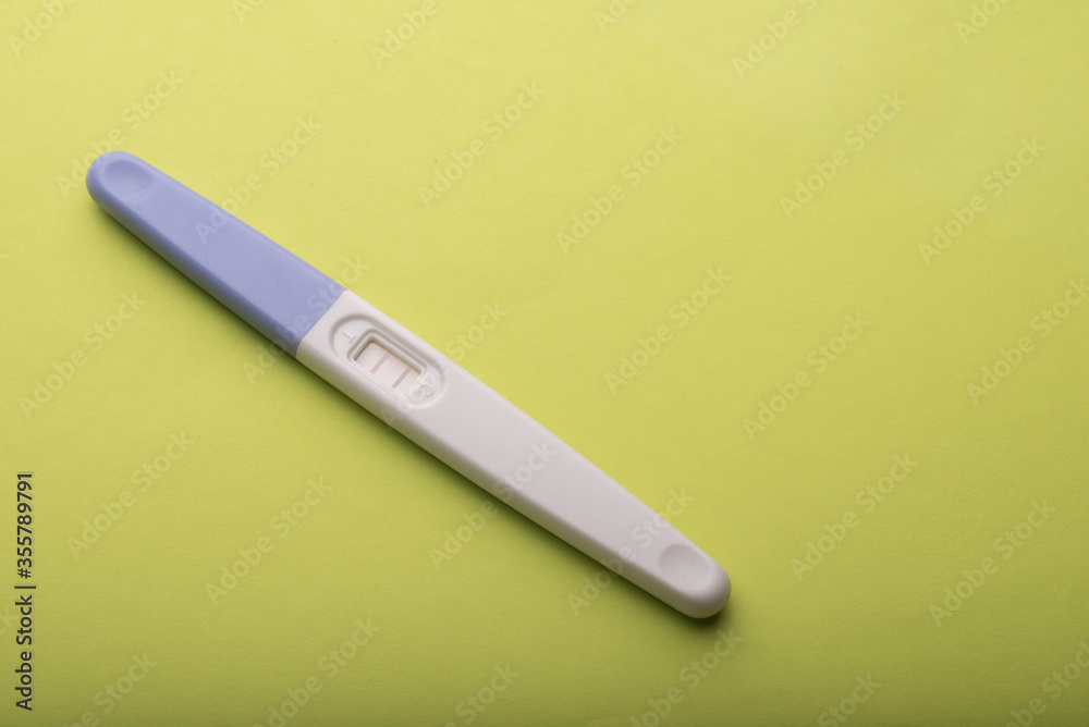 A pregnancy test kit isolated over various background A pregnancy test kit isolated over various background