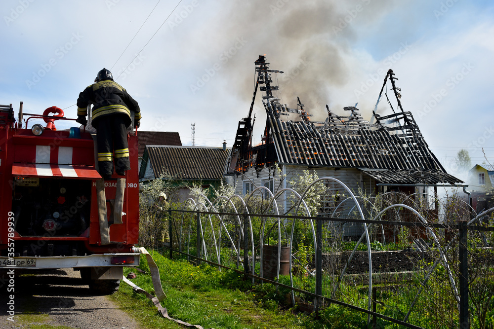 Little house is on fire . short circuit fire. Fire truck Stock Photo ...