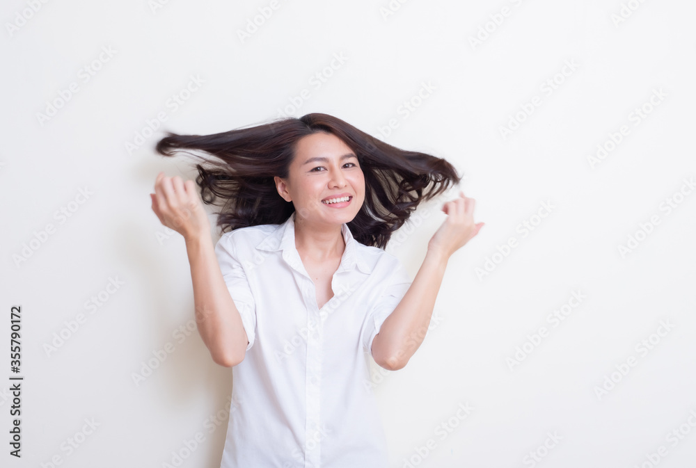 Portrait of young asian woman standing and smiling Portrait of young asian woman standing and smiling